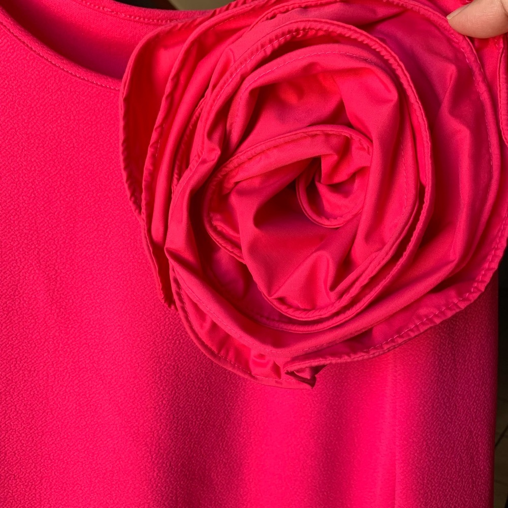 Beautiful pink blouse with flower on the side